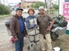 Couple of Yakutian locals admire the lady on the motorcycle