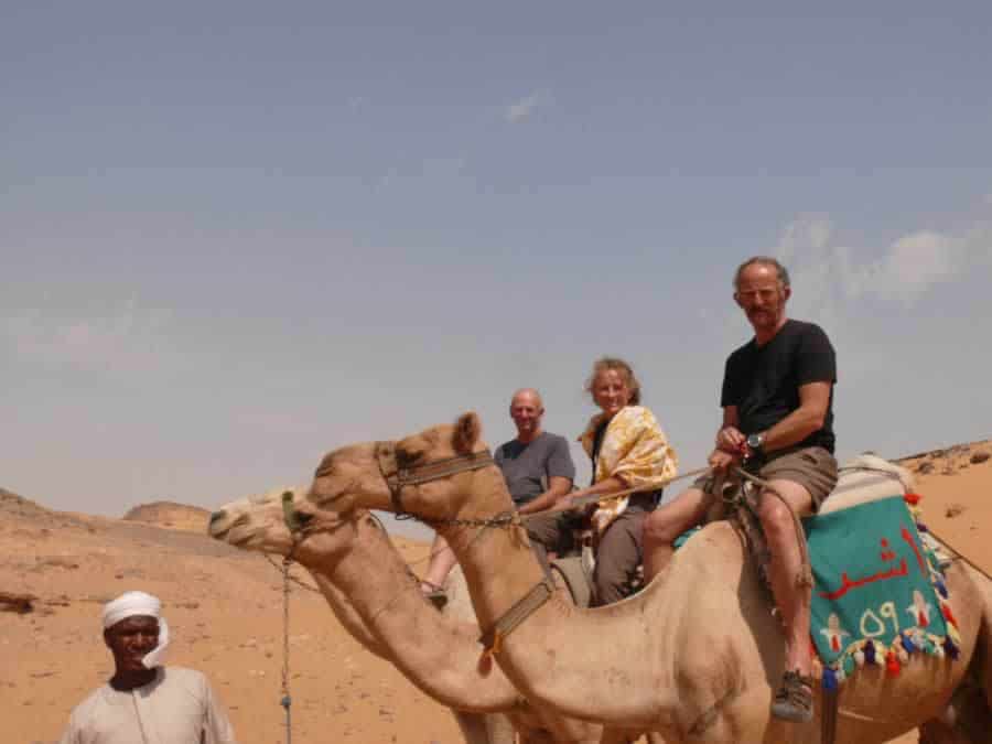 A triad of colonial camel wallahs