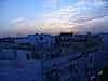 The whitewashed buildings of Sfax shimmering in the sunset