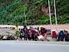 women slaving away restoring the stopbanks