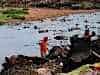 lady doing the family washing in the tip stream