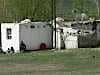 Quite a hovel, but complete with satellite TV note