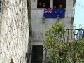 The Kiwi flag flies from the tower of Marco's birth home