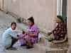 But the ordinary folks still live in the old city - here a fella gets his fingernails trimmed by mum