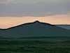 And in the distance the surrounding mountains with watchtowers on each of the high peaks