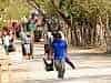Tradesmens entrance - the hawkers errive en masse to assault the visitors